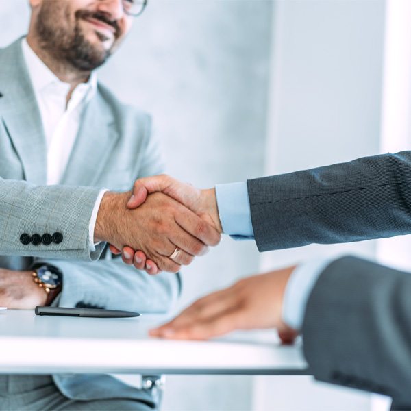 Businessmen shaking hands before a meeting.